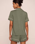 Model is wearing Gisele TENCEL™ Modal Relaxed Short PJ Set in Smokey Olive/Ivory