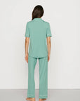 Model is wearing Gisele TENCEL™ Modal Short Sleeve & Pant PJ Set in Seagrass/White