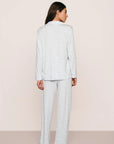 Model is wearing Gisele Printed TENCEL™ Modal Long PJ Set in Large Swans Ice Blue/Ivory