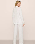 Model is wearing Gisele Printed TENCEL™ Modal Long PJ Set in SummerDaisyWhite/PaleMauve