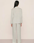 Model is wearing Gisele Printed TENCEL™ Modal Long PJ Set in Tide Dot Ivory/Ivory