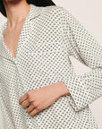 Model is wearing Gisele Printed TENCEL™ Modal Long PJ Set in Tide Dot Ivory/Ivory
