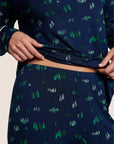 Model is wearing Gisele Printed TENCEL™ Modal Crewneck PJ Set in Forest Pine Navy/Ivory