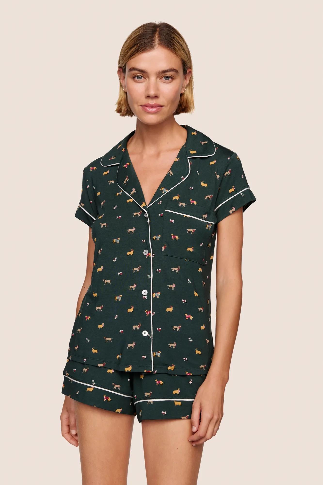 Model is wearing Gisele Printed TENCEL™ Modal Shortie Short PJ Set  in Holiday Dogs Pine/Ivory