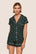 Model is wearing Gisele Printed TENCEL™ Modal Shortie Short PJ Set  in Holiday Dogs Pine/Ivory