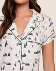 Model is wearing Gisele Printed TENCEL™ Modal Shortie Short PJ Set in Ski Chalet Ivory/Pine
