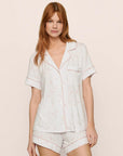 Model is wearing Gisele Printed TENCEL™ Modal Relaxed Short PJ Set in SummerDaisyWhite/PaleMauve