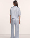 Model is wearing Inez Washable Silk Jacquard Relaxed Wide Leg Pant PJ Set in Powder Blue