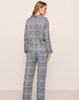 Model is wearing Inez Washable Silk Printed Long PJ Set in Azulejos Navy/Navy