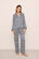 Model is wearing Inez Washable Silk Printed Long PJ Set in Azulejos Navy/Navy