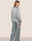 Model is wearing Inez Washable Silk Printed Long PJ Set in Classic Stripe Lead/Ivory