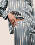 Model is wearing Inez Washable Silk Printed Long PJ Set in Classic Stripe Lead/Ivory