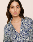 Model is wearing Inez Washable Silk Printed Short PJ Set in Azulejos Navy/Navy
