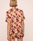 Model is wearing Inez Washable Silk Printed Short PJ Set in Botanical Flower Merlot/Merlot