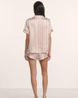 Model is wearing Inez Washable Silk Printed Short PJ Set in Brushstroke Misty Rose/Misty Rose