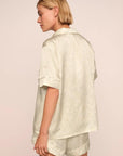 Model is wearing Inez Washable Silk Printed Short PJ Set in Foliage Mint Cream/Ivory