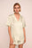 Model is wearing Inez Washable Silk Printed Short PJ Set in Foliage Mint Cream/Ivory