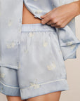 Model is wearing Inez Washable Silk Printed Short PJ Set in Large Swans Powder Blue/Ivory