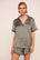 Model is wearing Inez Washable Silk Printed Short PJ Set in Petite Batik Smokeyolive/Ivory
