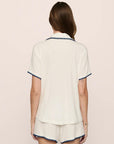 Model is wearing Frida TENCEL™ Modal Relaxed Short PJ Set in Ivory/Navy