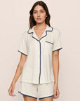 Model is wearing Frida TENCEL™ Modal Relaxed Short PJ Set in Ivory/Navy