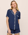 Model is wearing Frida TENCEL™ Modal Relaxed Short PJ Set in Navy/Ivory