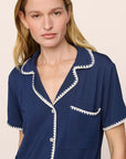 Model is wearing Frida TENCEL™ Modal Relaxed Short PJ Set in Navy/Ivory