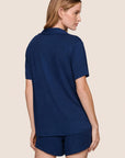 Model is wearing Gisele TENCEL™ Modal Rib Relaxed Short PJ Set in Navy