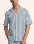 Model is wearing Men's Nautico Short PJ Set in Classic Stripe Slate Blue/Ivor