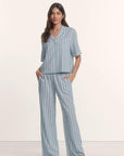 Model is wearing Nautico Relaxed Short Sleeve & Pant PJ Set in Classic Stripe Slate Blue/Ivor