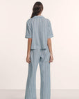 Model is wearing Nautico Relaxed Short Sleeve & Pant PJ Set in Classic Stripe Slate Blue/Ivor