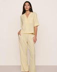 Model is wearing Nautico Relaxed Short Sleeve & Pant PJ Set in Classic Stripe Sunbeam/Ivory