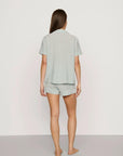 Model is wearing Nautico Shortie Short PJ Set in Regatta Stripe Seagrass/White