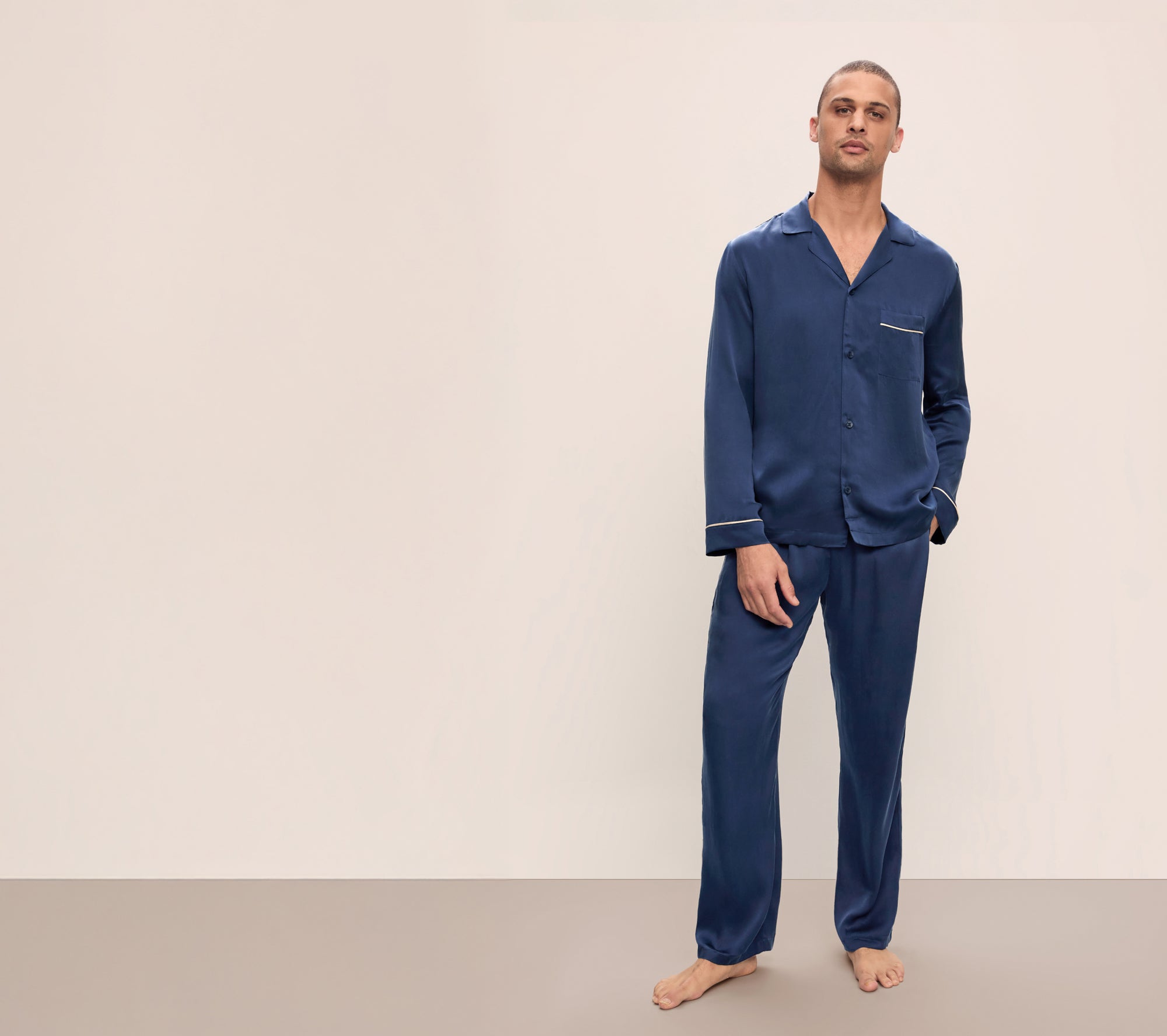 Model is wearing Charles Washable Silk Long PJ Set in True Navy/Champagne
