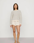 Model is wearing Coastal Cotton Sweater Polo in Regatta Stripe Summer Blue/Whi