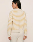 Model is wearing Coastal Cotton Sweater Polo in Stripe Almond Heather/Sunbeam