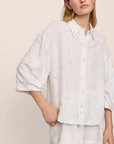 Model is wearing Linen Blend Relaxed Quarter Sleeve Top in SummerDaisyWhite/PeachDust