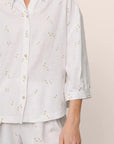 Model is wearing Linen Blend Relaxed Quarter Sleeve Top in SummerDaisyWhite/PeachDust