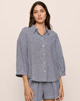Model is wearing Linen Blend Relaxed Quarter Sleeve Top in GinghamWhite/Navy