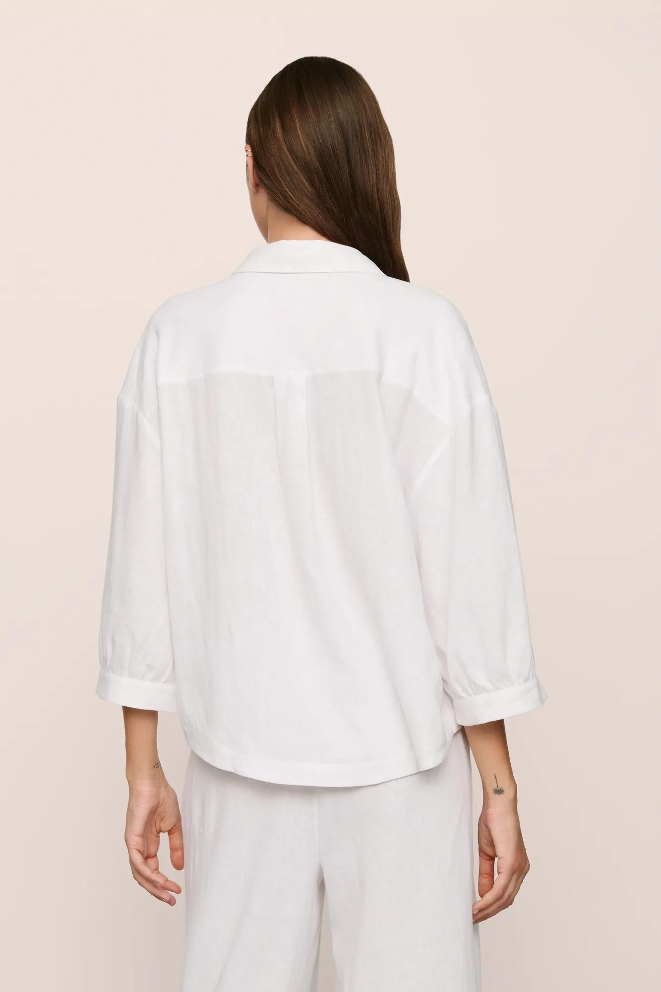 Model is wearing Linen Blend Relaxed Quarter Sleeve Top in White