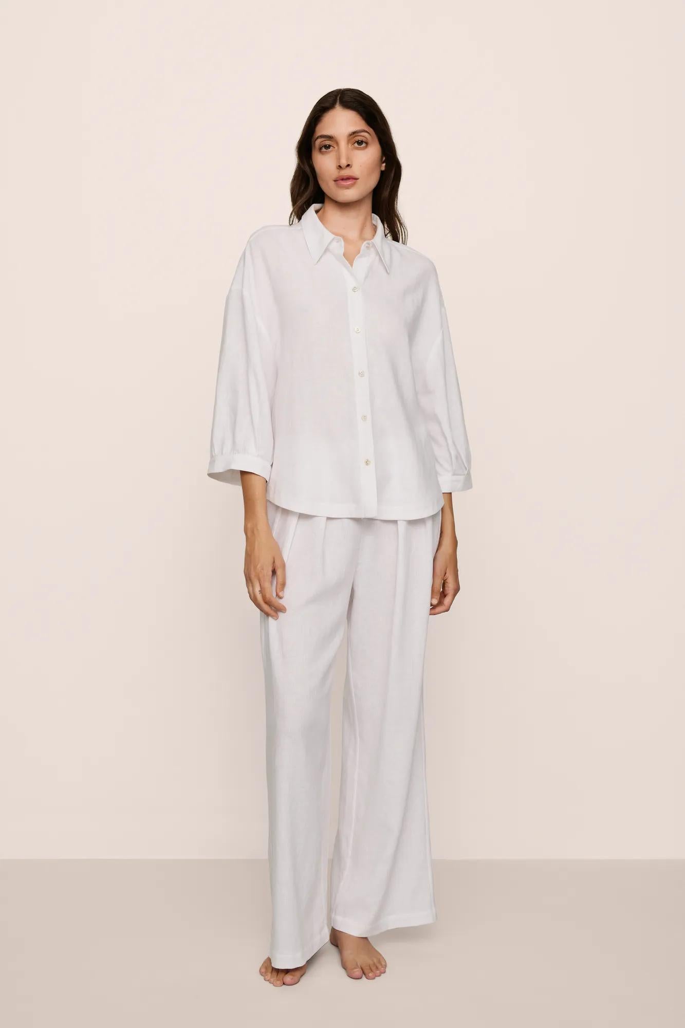 Model is wearing Linen Blend Relaxed Quarter Sleeve Top in White