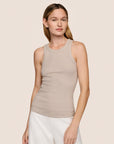 Model is wearing Essential Rib Tank in Beige