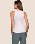 Model is wearing Essential Rib Tank in White
