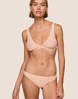 Model is wearing Soft Stretch Recycled Lace Thong in Buff