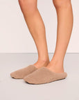 Model is wearing Sherpa Slipper in Warm Taupe