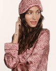 Model is wearing Inez Washable Silk Printed Eye Mask in Bloomscape Misty Rose/Mesa Rose