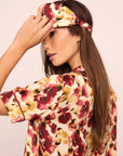 Model is wearing Inez Washable Silk Printed Eye Mask in Botanical Flower Merlot