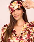 Model is wearing Inez Washable Silk Printed Eye Mask in Botanical Flower Merlot