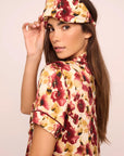 Model is wearing Inez Washable Silk Printed Eye Mask in Botanical Flower Merlot