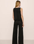 Model is wearing Organic Linen Knit High Waisted Pant in Black